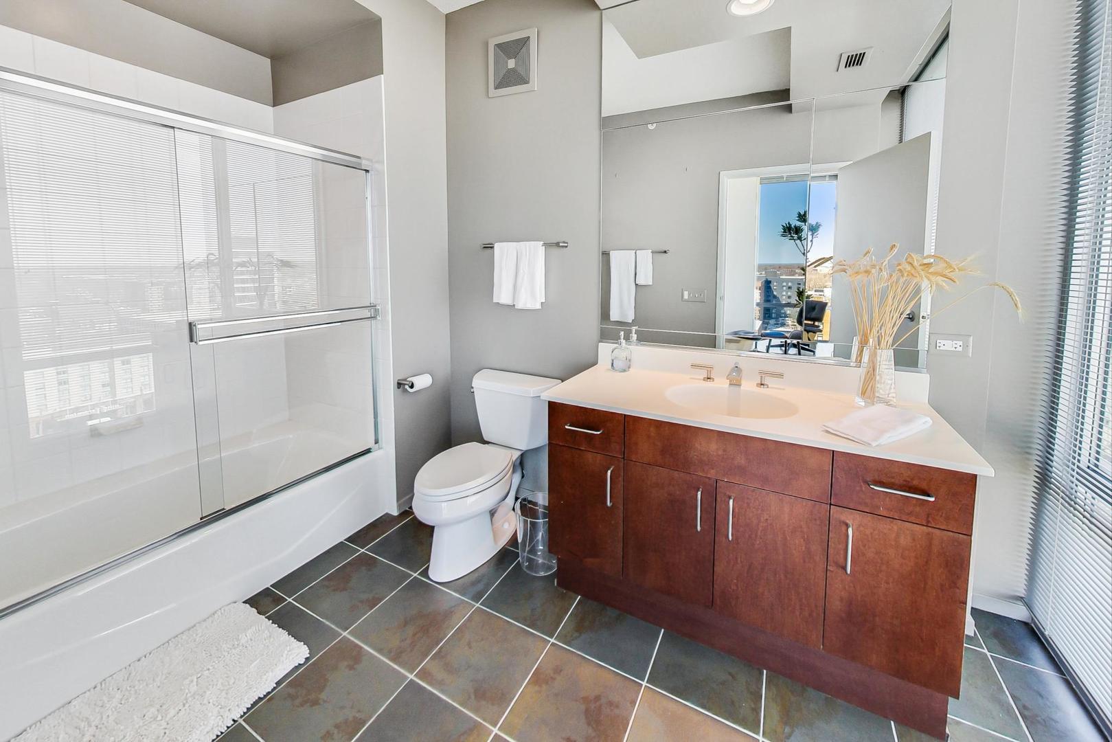 800 Elgin Road, Unit PH02 Evanston, IL 60201 - Photo 34 of 43 a bathroom with a sink toilet and shower