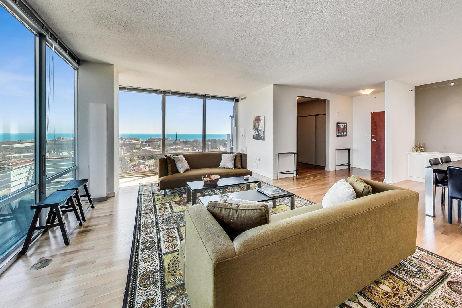 800 Elgin Road, Unit PH02 Evanston, IL 60201 - Photo 5 of 43 a living room with furniture and a large window
