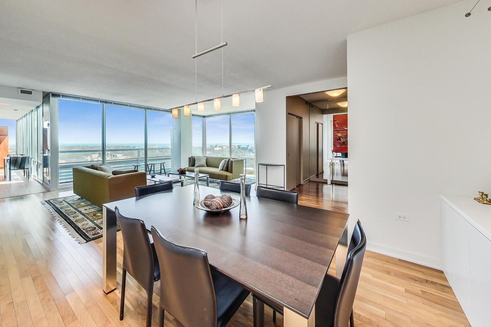 800 Elgin Road, Unit PH02 Evanston, IL 60201 - Photo 8 of 43 a dining room with furniture and wooden floor