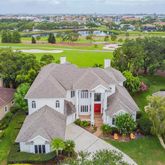 an aerial view of a house with big yard