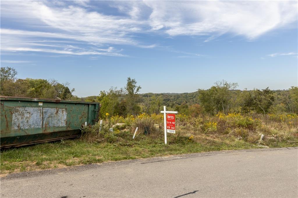77 Ridgewood Drive McDonald, PA 15057 - Photo 4 of 20 a view of a road with a barn in front of it