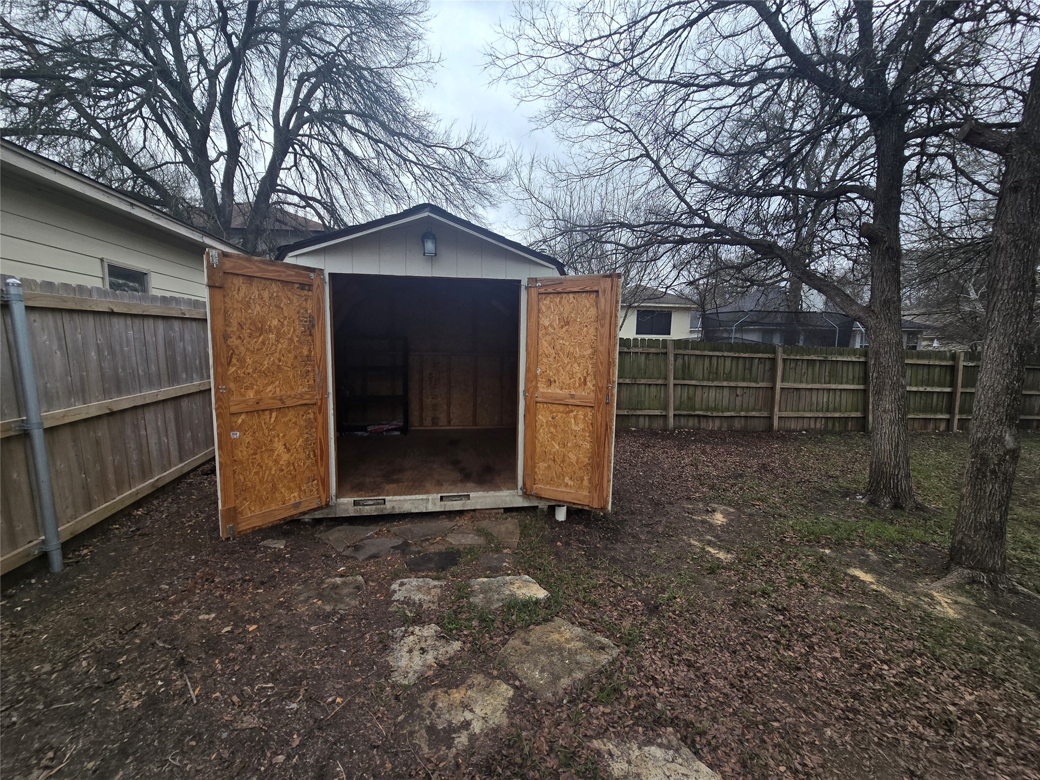 103 Hummingbird Court Cedar Creek, TX 78612 - Photo 21 of 24 a view of backyard with large tree