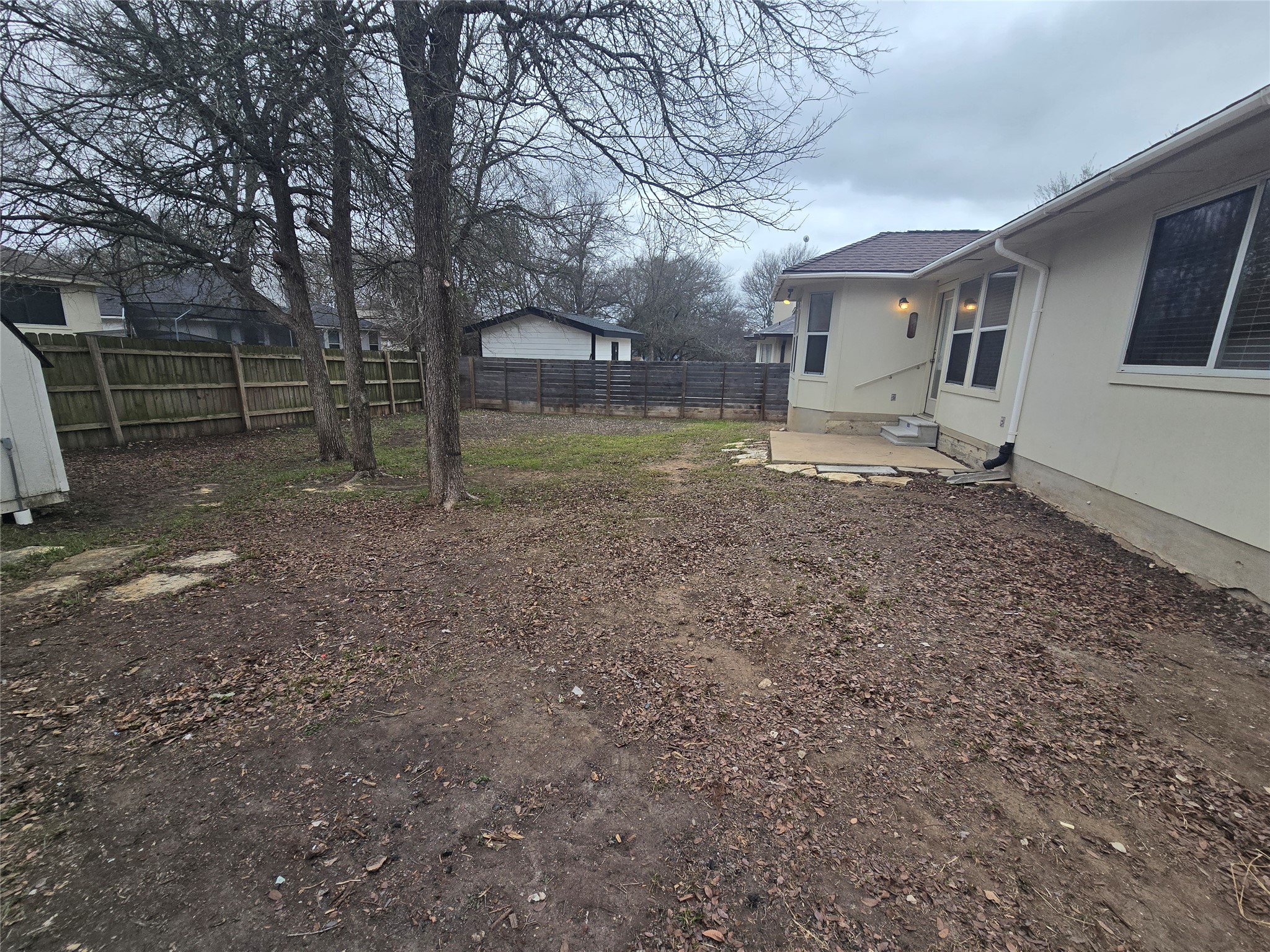 103 Hummingbird Court Cedar Creek, TX 78612 - Photo 22 of 24 a view of a house with a yard