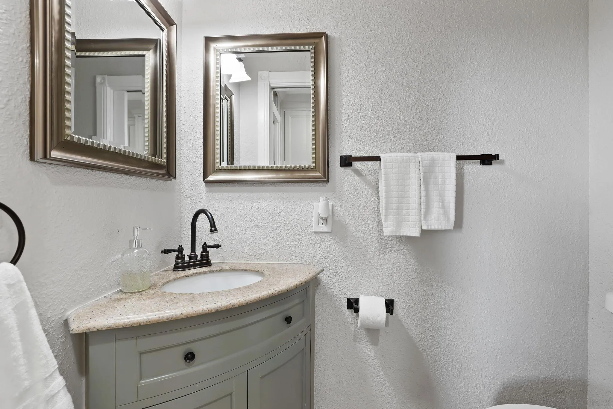 750 Jericho Drive Fallbrook, CA 92028 - Photo 21 of 69 a bathroom with a granite countertop sink and a mirror