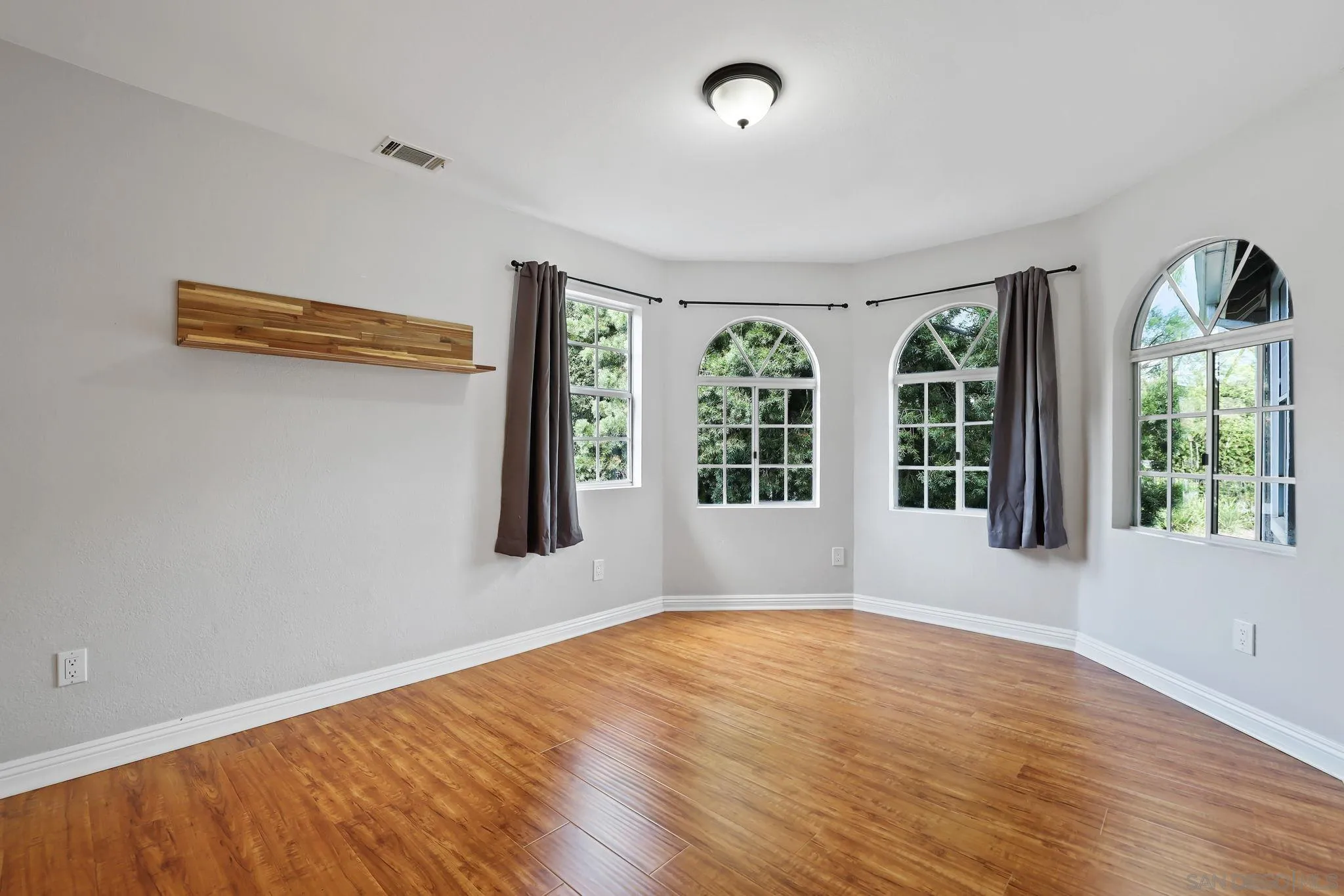 750 Jericho Drive Fallbrook, CA 92028 - Photo 33 of 69 wooden floor in an empty room with windows