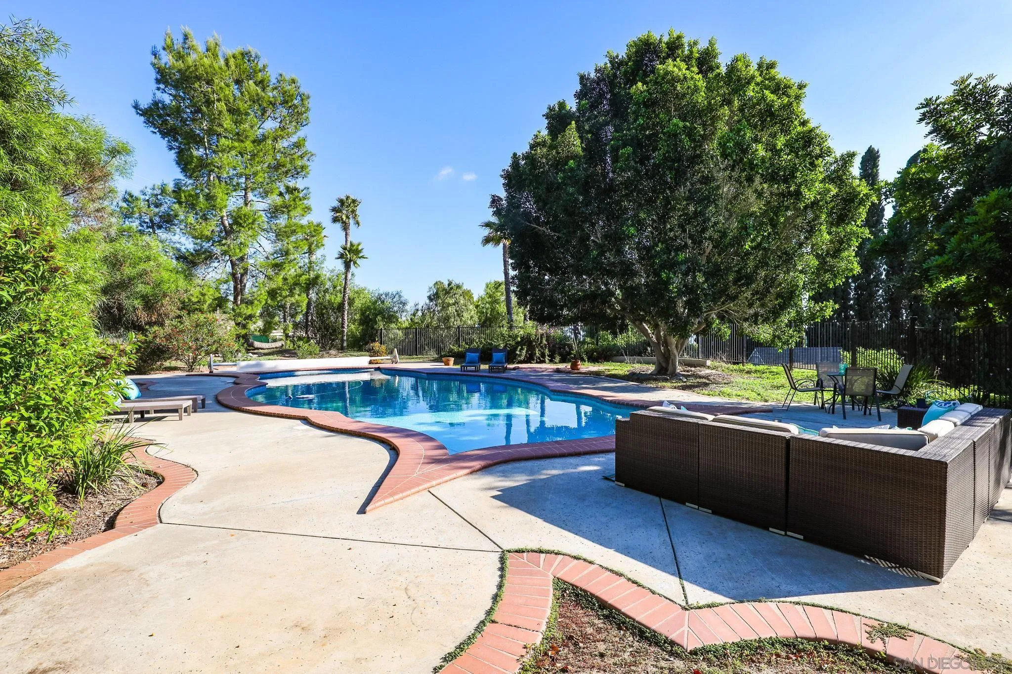750 Jericho Drive Fallbrook, CA 92028 - Photo 62 of 69 a view of a swimming pool with a lounge chair