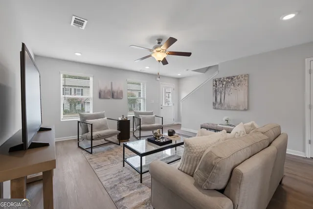 a living room with furniture and a window