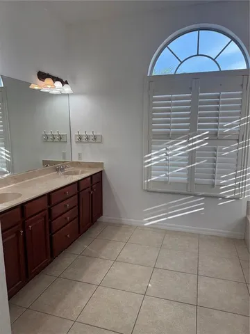 a kitchen with a cabinets and chandelier