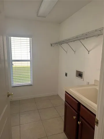 a bathroom with a sink a vanity and a bathtub
