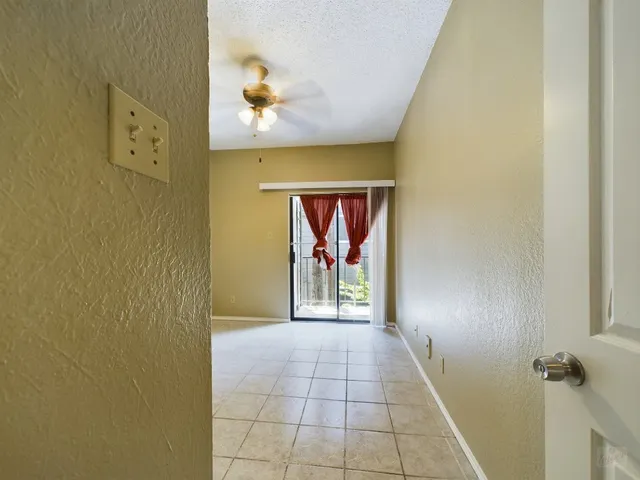 a view of a hallway with a door