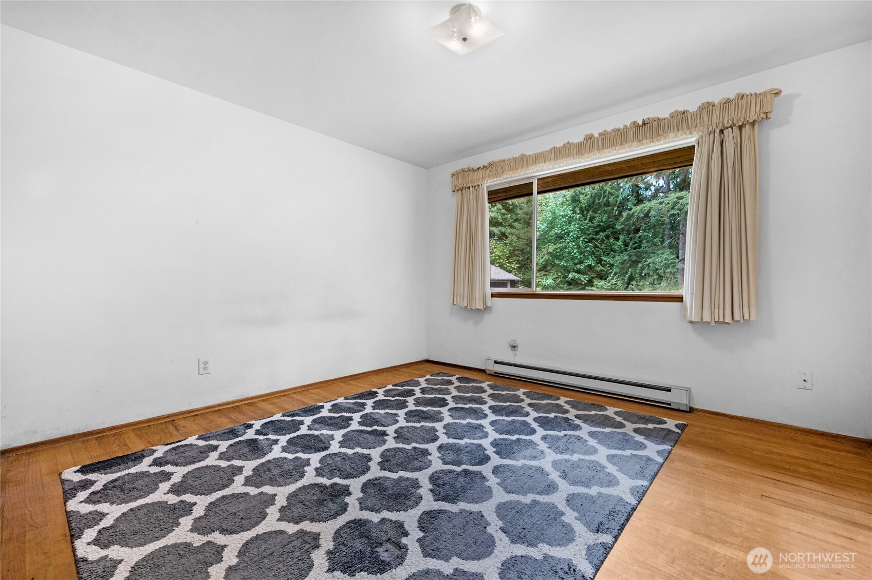 22221 45th Avenue Southeast Bothell, WA 98021 - Photo 12 of 32 a view of an empty room with a window