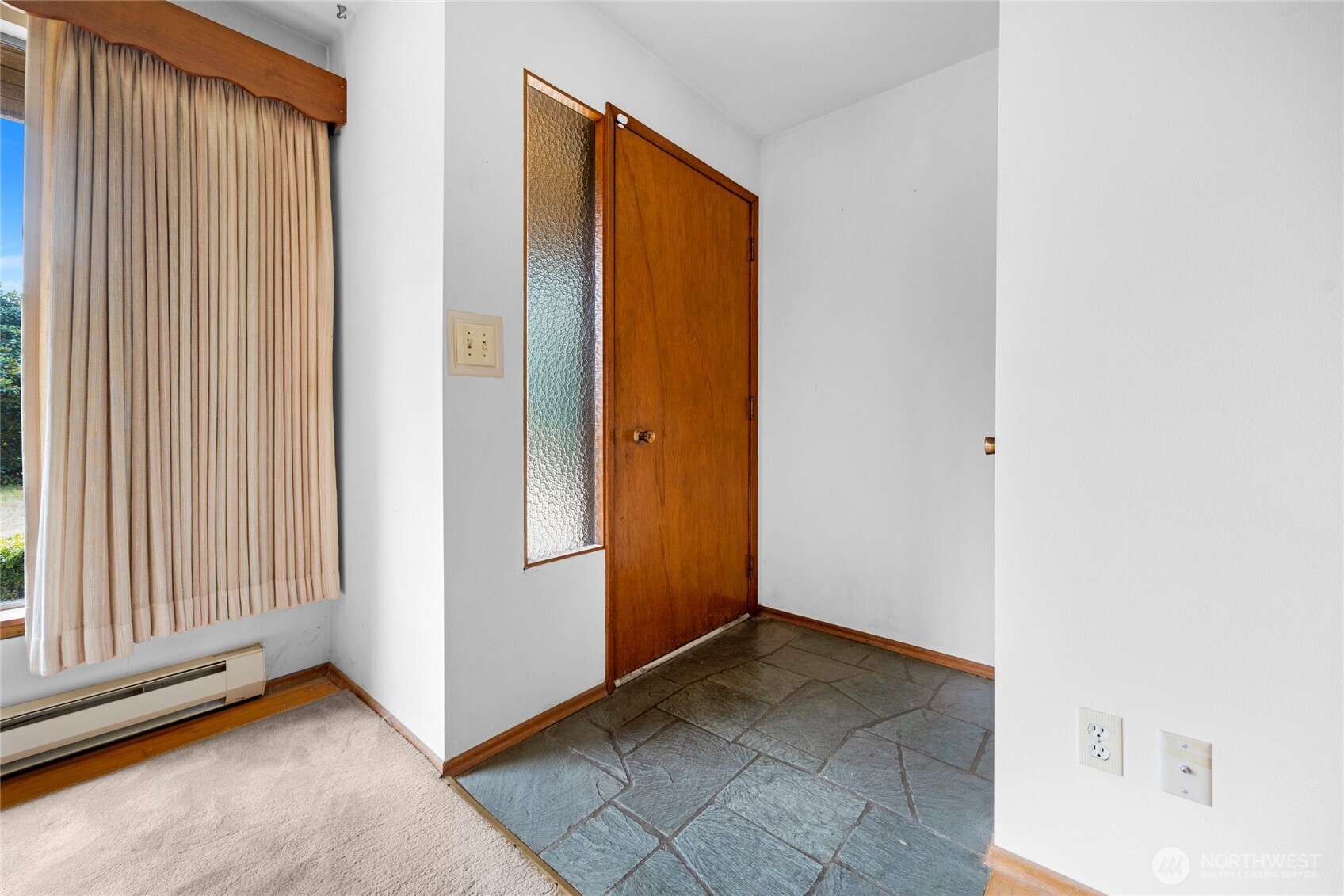 22221 45th Avenue Southeast Bothell, WA 98021 - Photo 2 of 32 a view of a livingroom with an empty space and a window