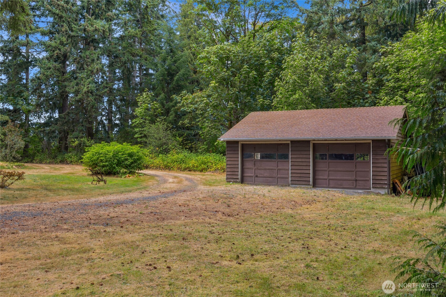 22221 45th Avenue Southeast Bothell, WA 98021 - Photo 21 of 32 a front view of a house with a yard and garage