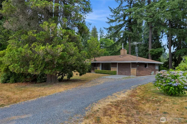 a front view of a house with yard