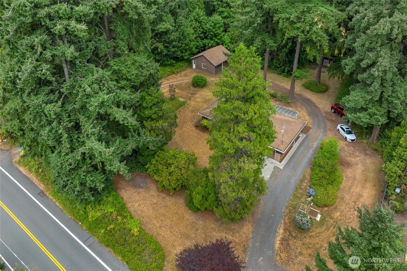 22221 45th Avenue Southeast Bothell, WA 98021 - Photo 31 of 32 an aerial view of a house with a yard and greenery