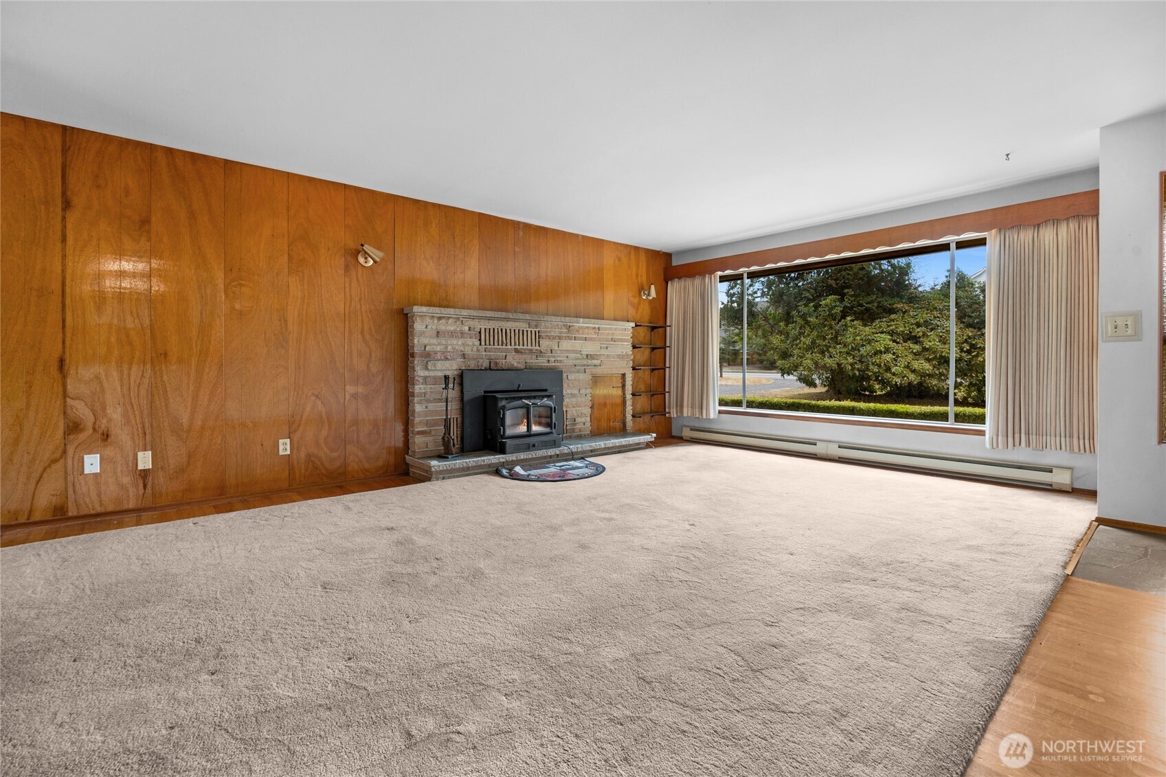 22221 45th Avenue Southeast Bothell, WA 98021 - Photo 4 of 32 an empty room with windows fire place and fireplace