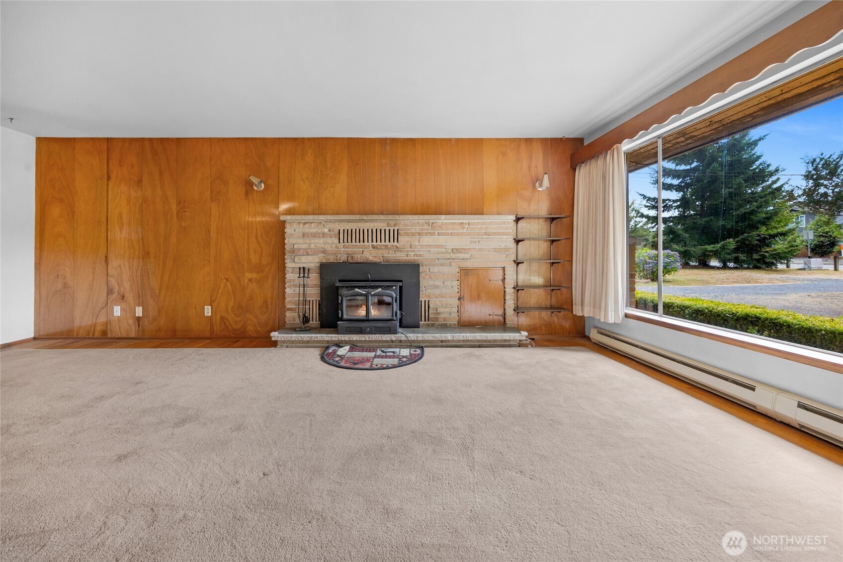 22221 45th Avenue Southeast Bothell, WA 98021 - Photo 5 of 32 an empty room with furniture and a fireplace