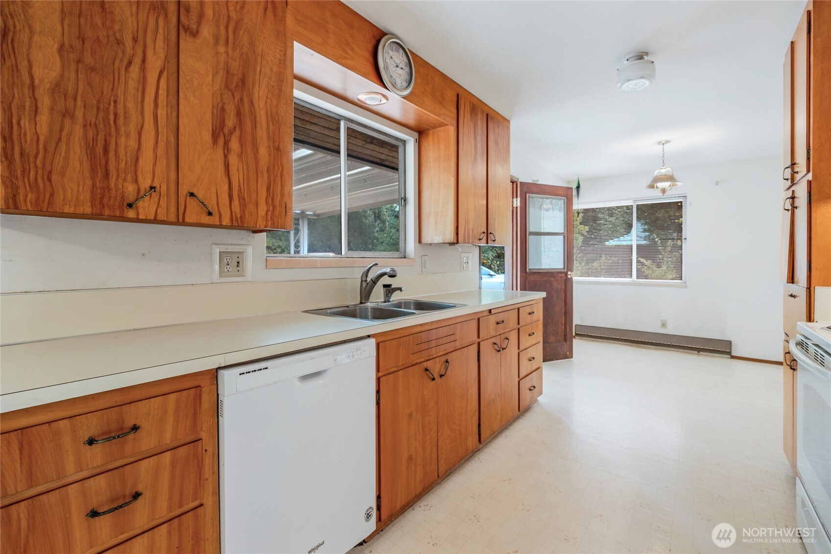 22221 45th Avenue Southeast Bothell, WA 98021 - Photo 8 of 32 a kitchen with stainless steel appliances granite countertop a sink a stove and a microwave