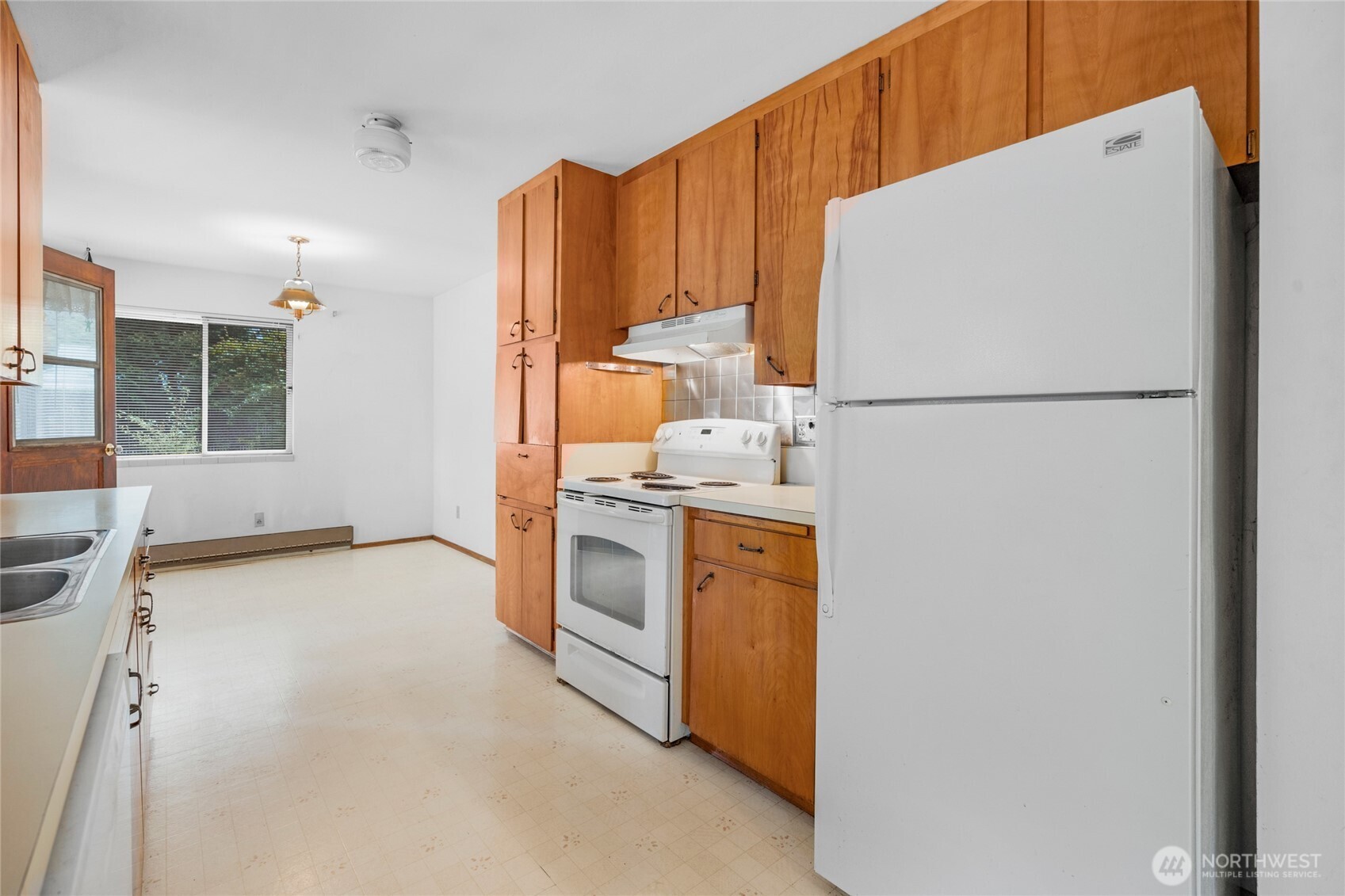 22221 45th Avenue Southeast Bothell, WA 98021 - Photo 9 of 32 a kitchen with stainless steel appliances a refrigerator and a stove