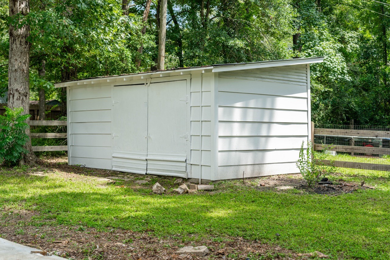 13400 Nicholson Road Conroe, TX 77303 - Photo 32 of 36 The home also includes a shed: which owner could use as a work shed, more storage, or a sheshed.