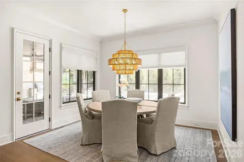 a dining room with furniture window wooden floor