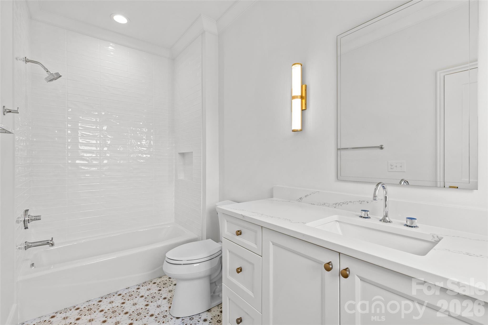 1321 Ferncliff Road Charlotte, NC 28211 - Photo 29 of 47 a bathroom with a sink a toilet and shower