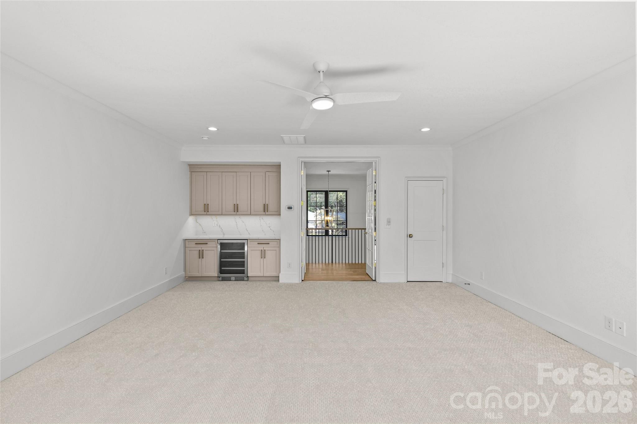 1321 Ferncliff Road Charlotte, NC 28211 - Photo 31 of 47 an empty room with a cabinet and a view of kitchen