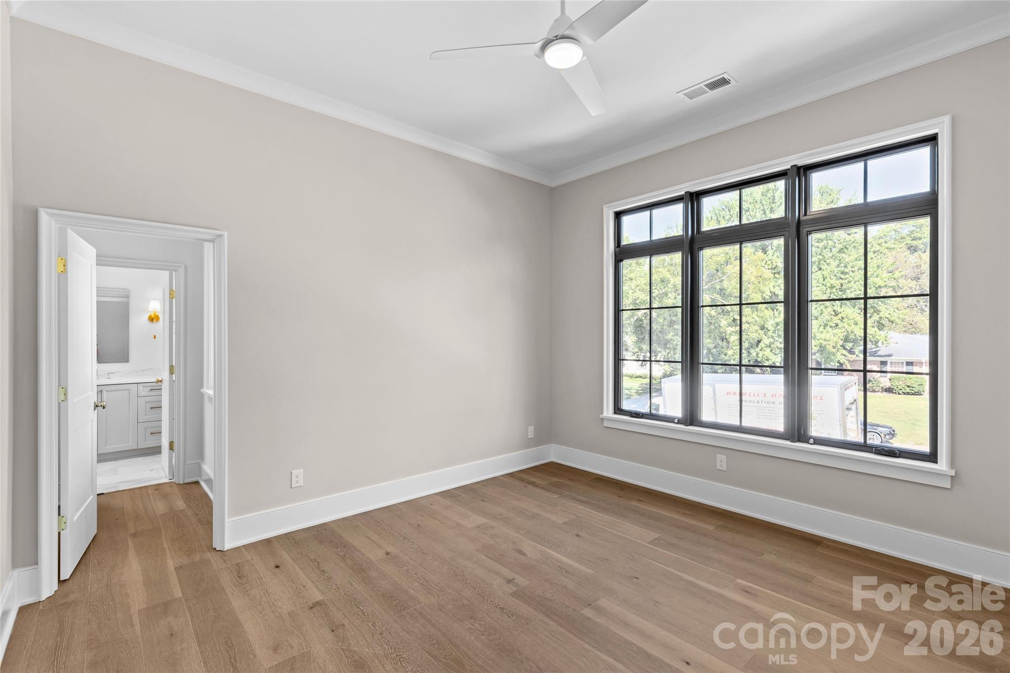 1321 Ferncliff Road Charlotte, NC 28211 - Photo 33 of 47 an empty room with wooden floor and windows