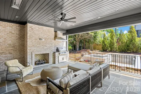 a outdoor space with patio furniture and a fireplace