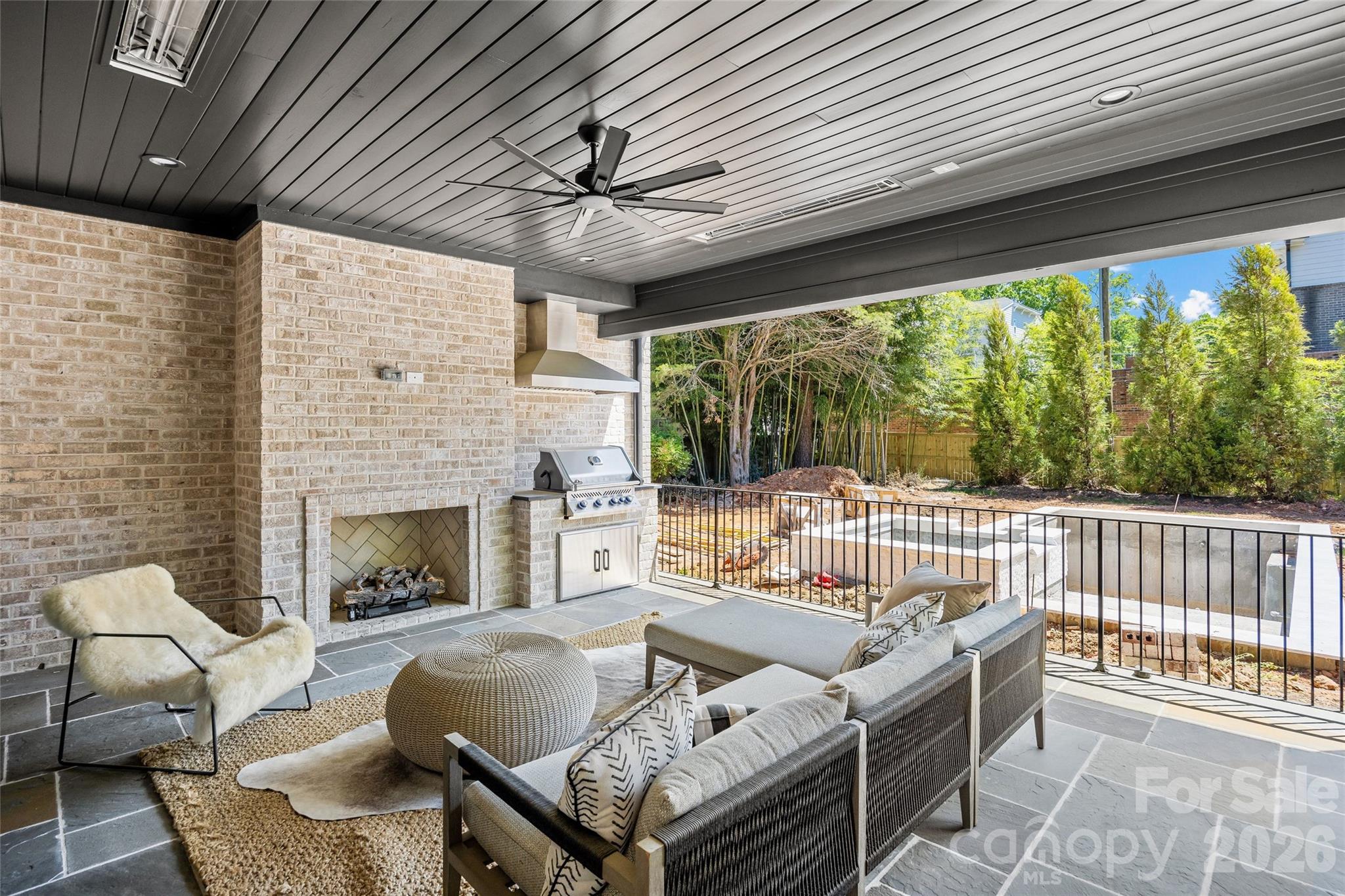 1321 Ferncliff Road Charlotte, NC 28211 - Photo 41 of 47 a outdoor space with patio furniture and a fireplace