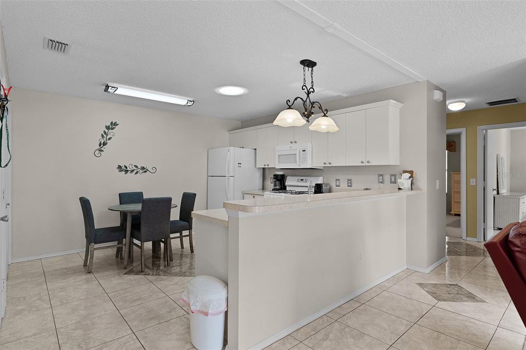 2623 Ascot Loop The Villages, FL 32162 - Photo 12 of 40 a view of kitchen with furniture and refrigerator