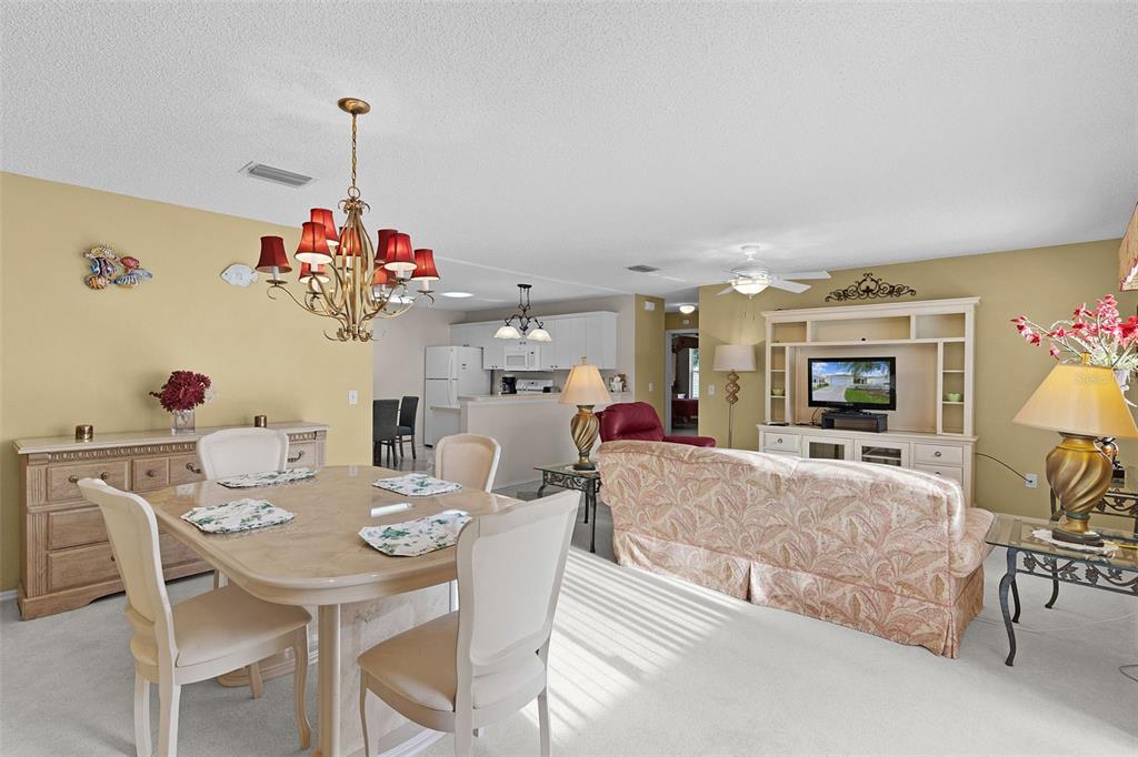 2623 Ascot Loop The Villages, FL 32162 - Photo 3 of 40 a view of a dining room with furniture and chandelier