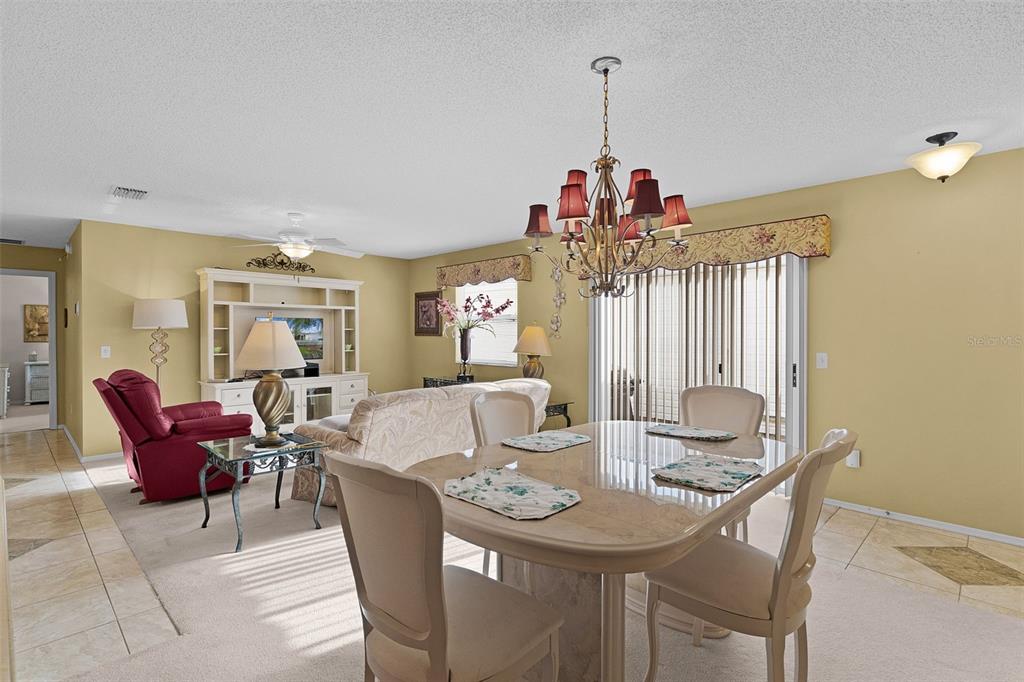 2623 Ascot Loop The Villages, FL 32162 - Photo 8 of 40 a view of a dining room with furniture and chandelier