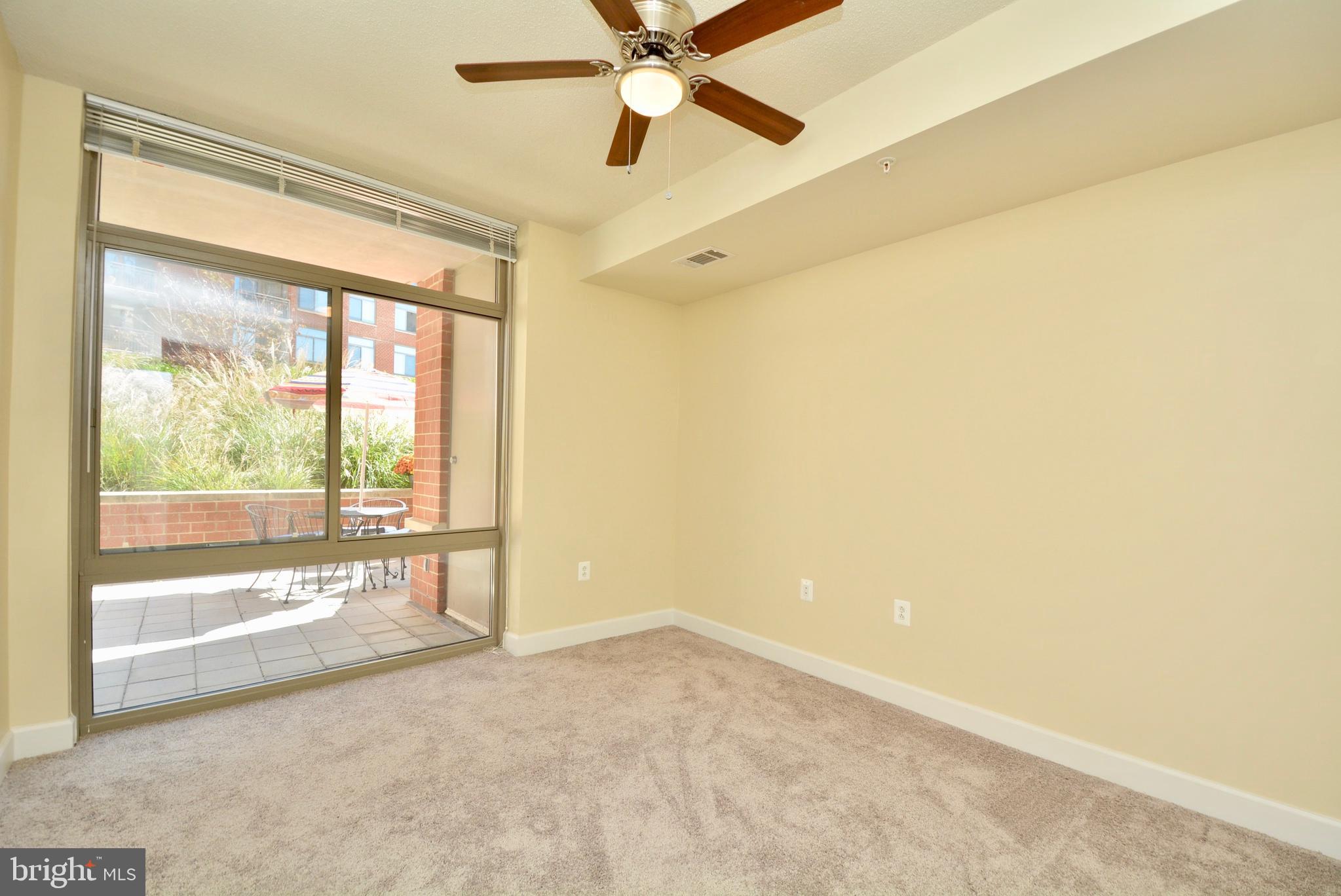 3650 South Glebe Road, Unit 262 Arlington, VA 22202 - Photo 7 of 35 Bedroom w/ walk-in closet, view of patio