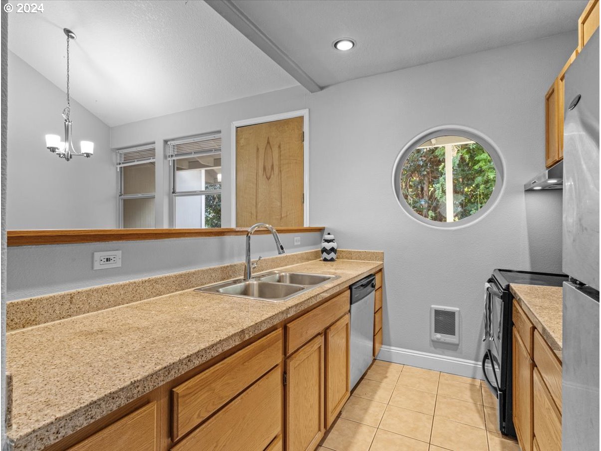 5221 Southwest View Point Terrace, Unit 2 Portland, OR 97239 - Photo 11 of 30 a bathroom with a sink and a mirror