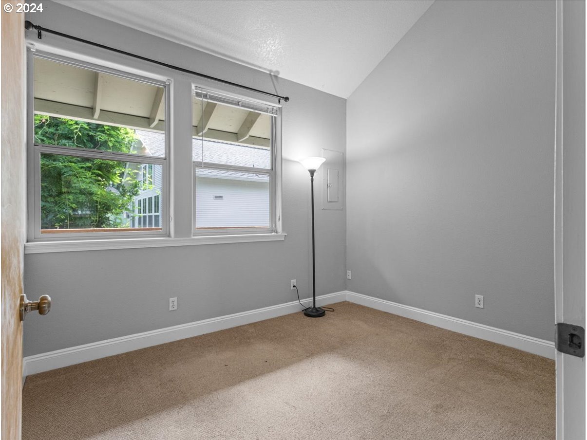 5221 Southwest View Point Terrace, Unit 2 Portland, OR 97239 - Photo 13 of 30 an empty room with a window