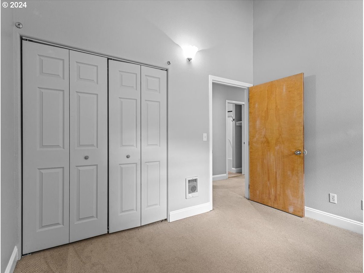 5221 Southwest View Point Terrace, Unit 2 Portland, OR 97239 - Photo 14 of 30 a view of an empty room with chandelier