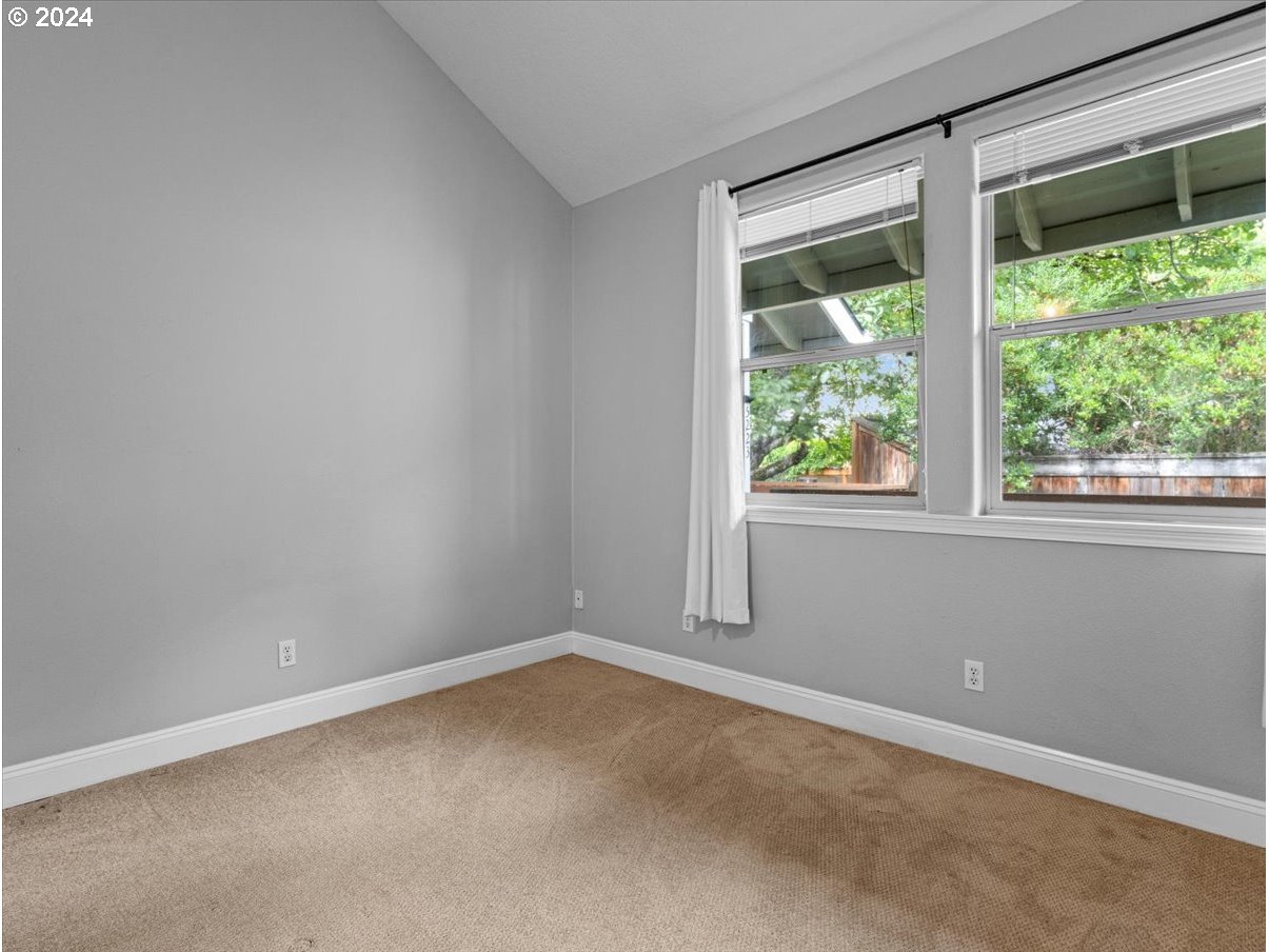 5221 Southwest View Point Terrace, Unit 2 Portland, OR 97239 - Photo 15 of 30 an empty room with a window