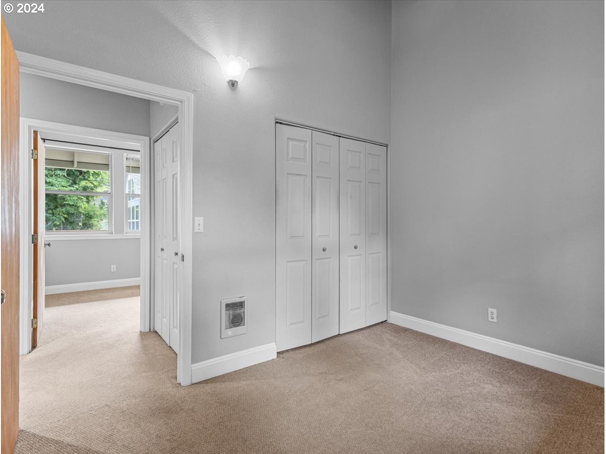 5221 Southwest View Point Terrace, Unit 2 Portland, OR 97239 - Photo 16 of 30 a view of an empty room and window