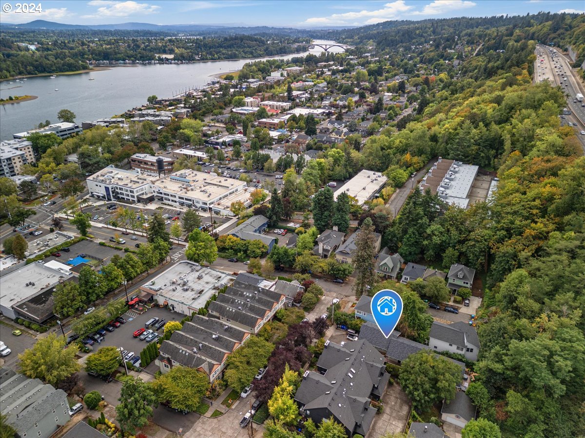 5221 Southwest View Point Terrace, Unit 2 Portland, OR 97239 - Photo 26 of 30 an aerial view of city and lake with trees