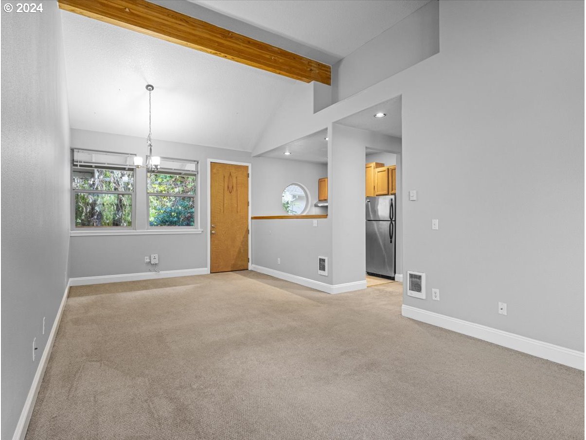 5221 Southwest View Point Terrace, Unit 2 Portland, OR 97239 - Photo 6 of 30 an empty room with windows and closet
