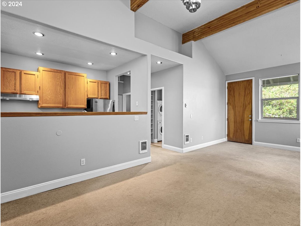 5221 Southwest View Point Terrace, Unit 2 Portland, OR 97239 - Photo 7 of 30 an empty room with window and wooden floor