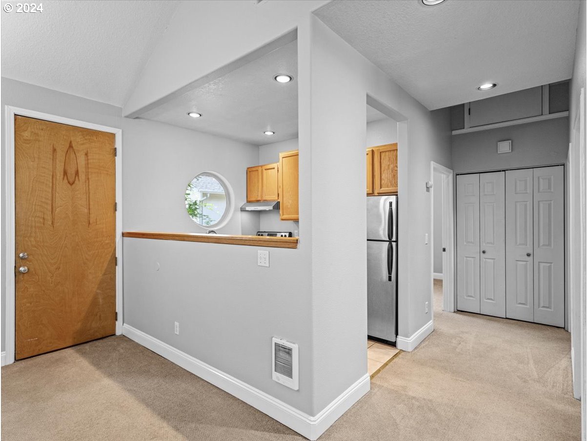 5221 Southwest View Point Terrace, Unit 2 Portland, OR 97239 - Photo 9 of 30 a view of kitchen with refrigerator and window