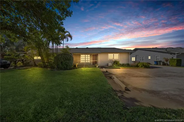 a view of multiple houses with a yard