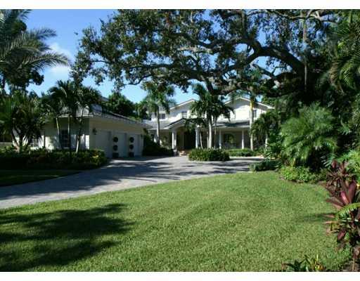 61 South River Road Stuart, FL 34996 - Photo 1 of 8 a view of backyard with swimming pool and green space