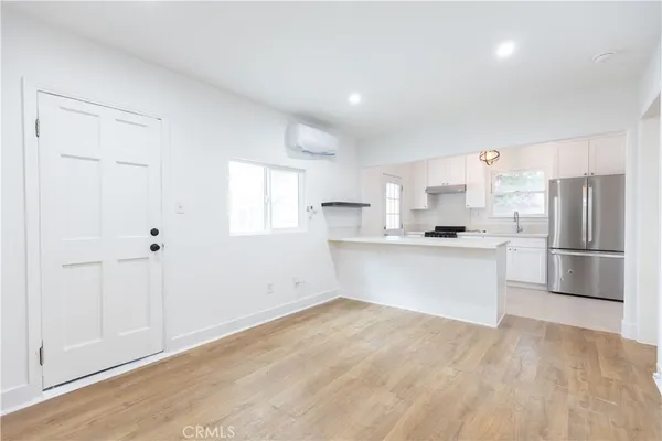 a view of kitchen with wooden floor