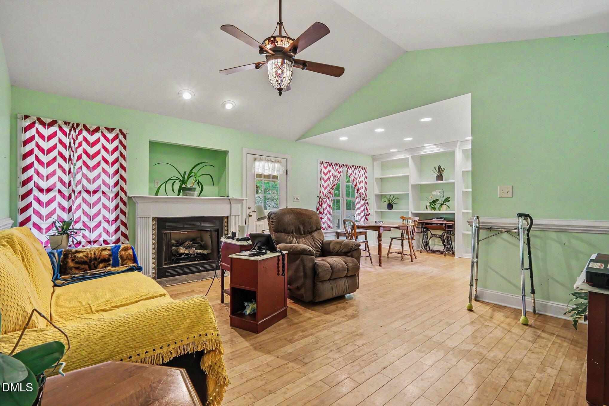 1750 Tom Oakley Road Timberlake, NC 27583 - Photo 5 of 31 a living room with furniture and a fireplace