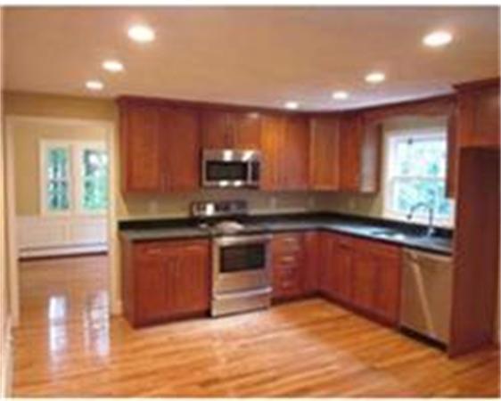 4 Scott Road Harvard, MA 01451 - Photo 4 of 12 a kitchen with stainless steel appliances granite countertop a refrigerator sink and cabinets