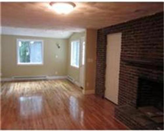 4 Scott Road Harvard, MA 01451 - Photo 8 of 12 a view of an empty room with wooden floor and a window