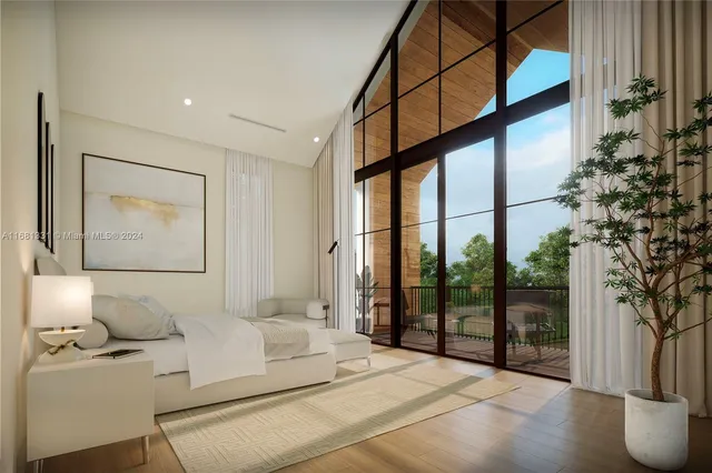 a spacious bedroom with a large bed and a chandelier